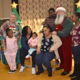 Another family meets with Santa and Mrs. Claus on Thursday.